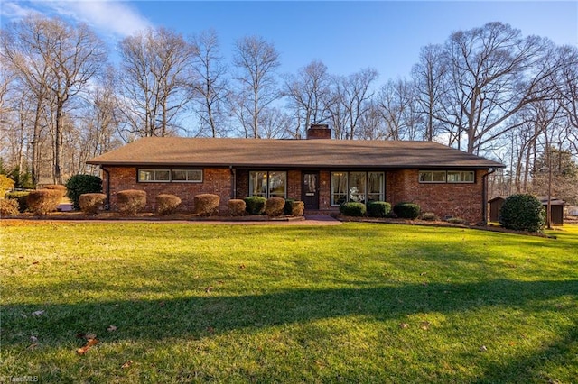 ranch-style home with a front lawn