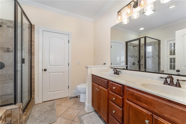 bathroom featuring tile patterned floors, crown molding, vanity, and a shower with shower door