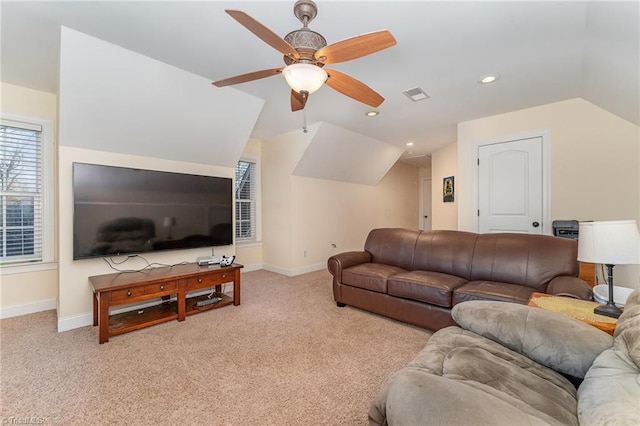 living room with ceiling fan, lofted ceiling, and light carpet