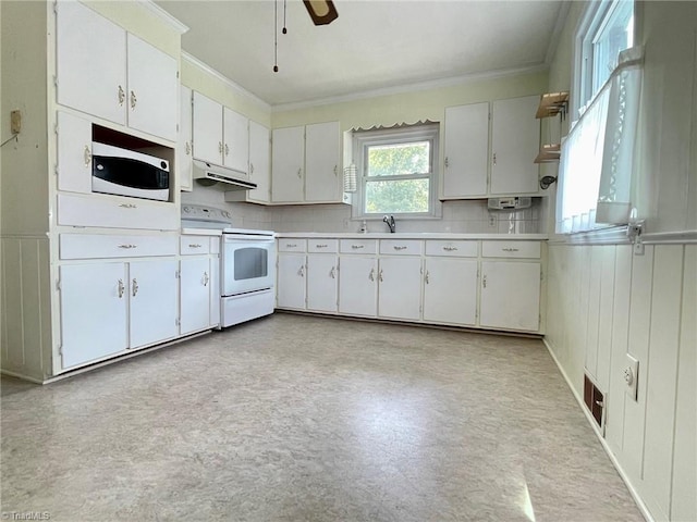 kitchen featuring light countertops, white appliances, white cabinets, and under cabinet range hood