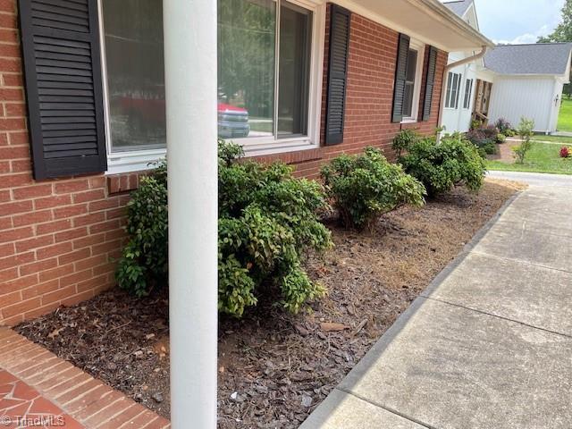 view of home's exterior with brick siding