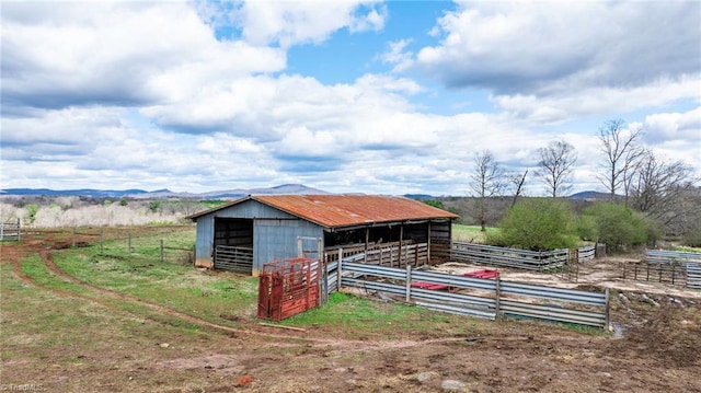 view of outbuilding with a rural view