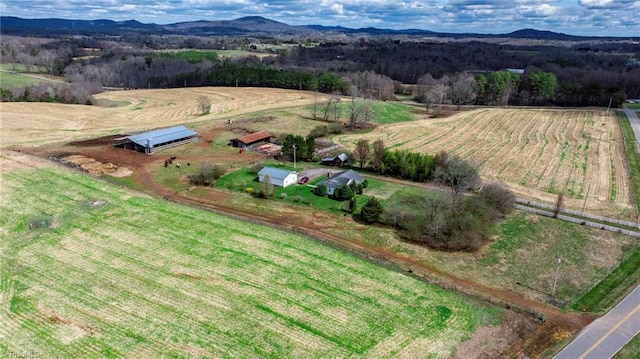 birds eye view of property with a rural view