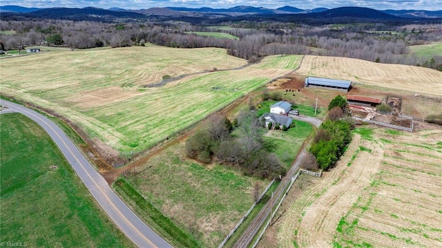 bird's eye view with a mountain view and a rural view