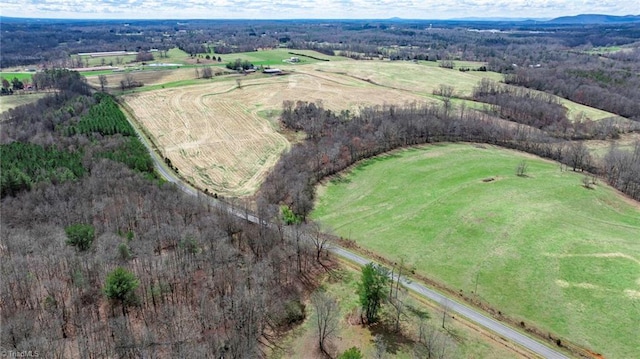 birds eye view of property with a rural view