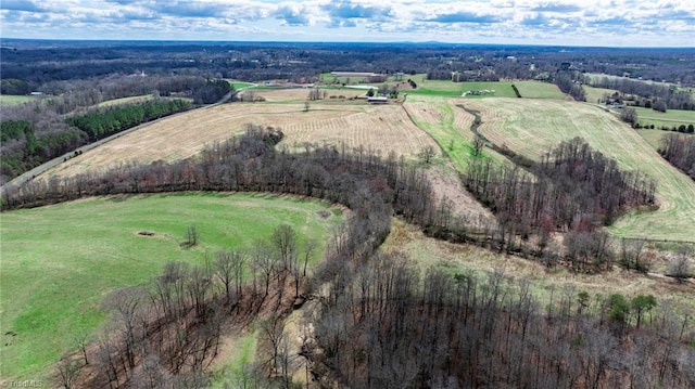 birds eye view of property featuring a rural view