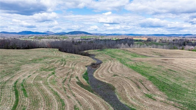 drone / aerial view featuring a mountain view