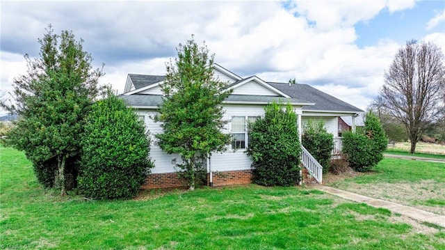 obstructed view of property featuring a front lawn