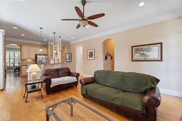 5584 Foxgate Cir, Winston-Salem, NC 27106 - living room featuring arched walkways, a ceiling fan, recessed lighting, baseboards, and ornamental molding