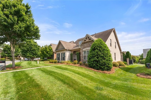 5584 Foxgate Cir, Winston-Salem, NC 27106 - view of front of house with stone siding and a front yard