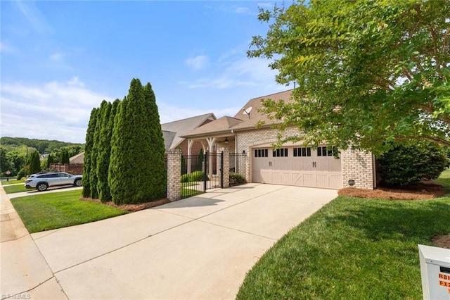 5584 Foxgate Cir, Winston-Salem, NC 27106 - view of front of home featuring brick siding, an attached garage, concrete driveway, and a gate