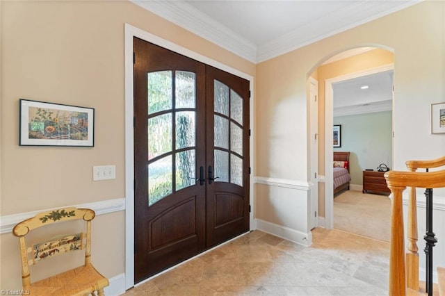 5584 Foxgate Cir, Winston-Salem, NC 27106 - foyer entrance with french doors, arched walkways, and crown molding