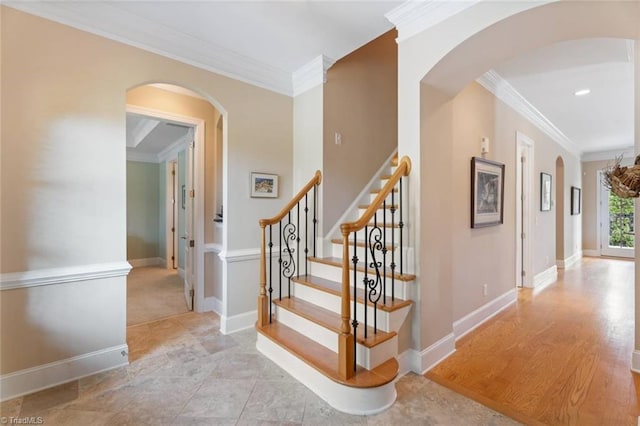 5584 Foxgate Cir, Winston-Salem, NC 27106 - staircase with crown molding, arched walkways, and baseboards