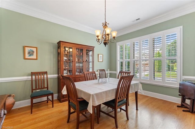 5584 Foxgate Cir, Winston-Salem, NC 27106 - dining space with a chandelier, light wood-style floors, ornamental molding, and baseboards