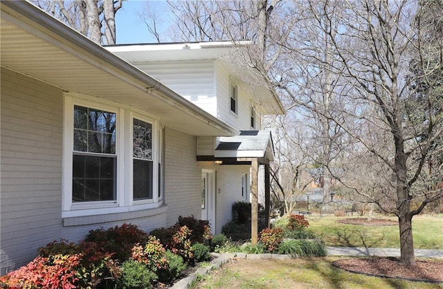 view of property exterior with brick siding