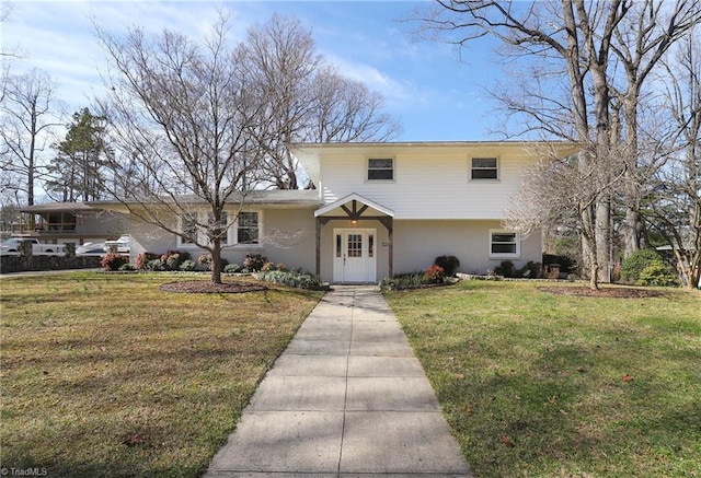 split level home featuring a front lawn