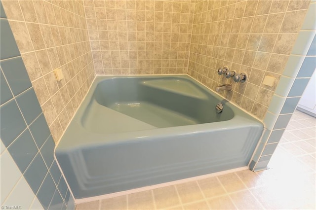 bathroom featuring a bathing tub and tile patterned floors