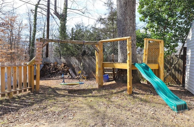 view of playground featuring fence