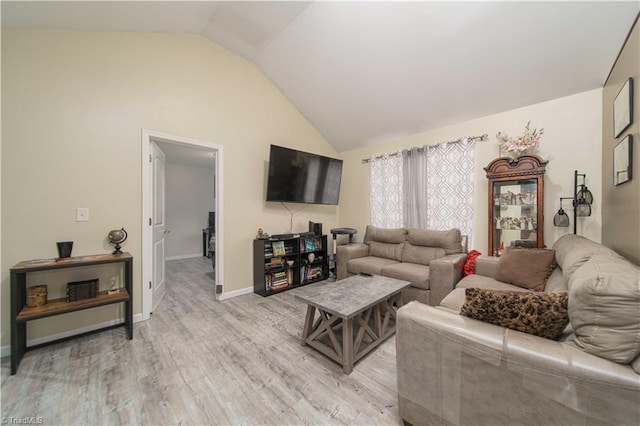 living room featuring lofted ceiling and light wood-type flooring