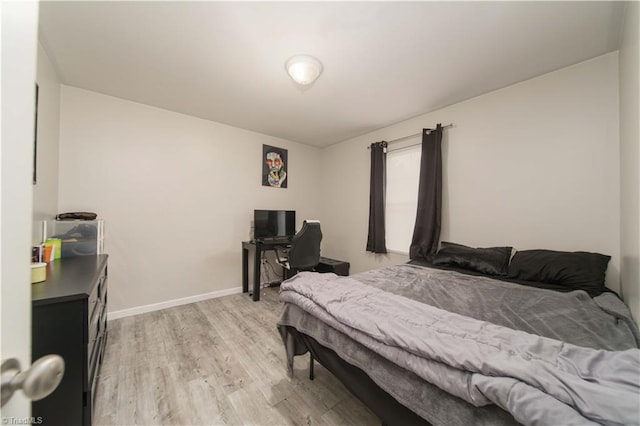 bedroom with light wood-type flooring