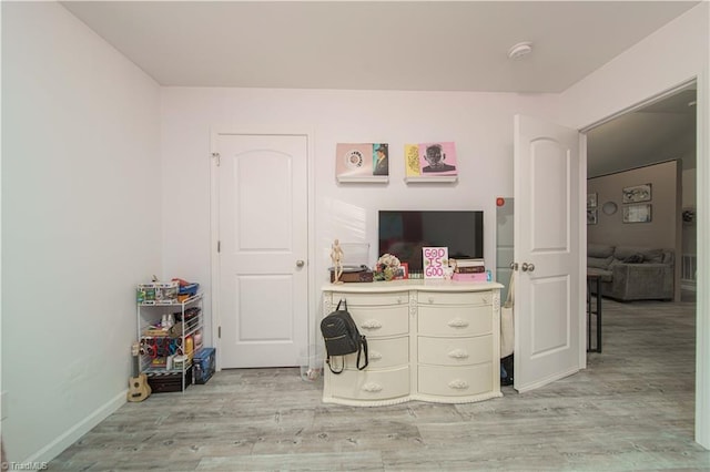 bedroom with light wood-type flooring