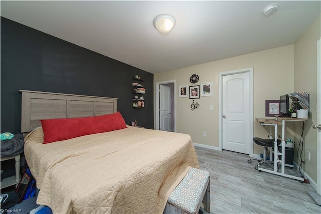 bedroom featuring wood-type flooring