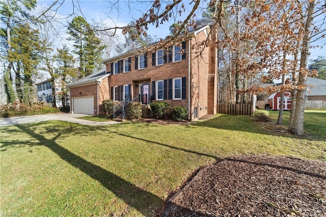 view of front of home with a front yard and a garage