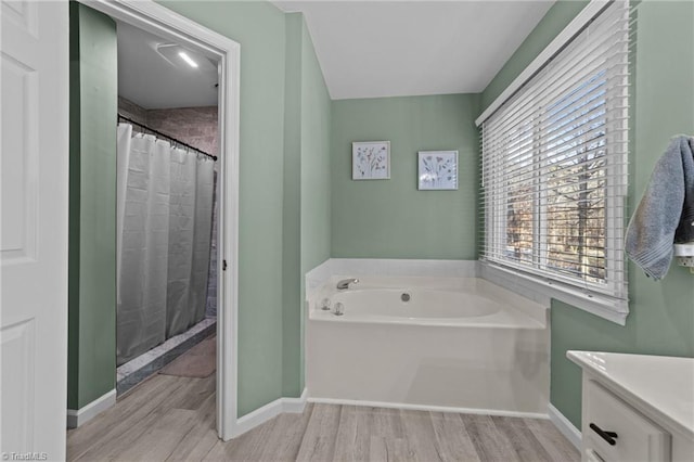 bathroom featuring separate shower and tub and hardwood / wood-style flooring