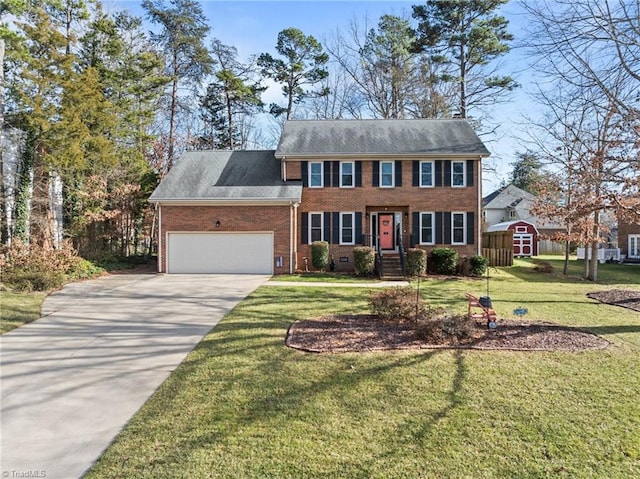 colonial home with a front lawn and a garage