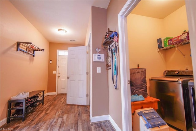 laundry room with wood-type flooring