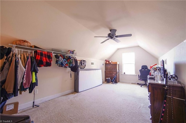 interior space featuring ceiling fan, light colored carpet, and vaulted ceiling