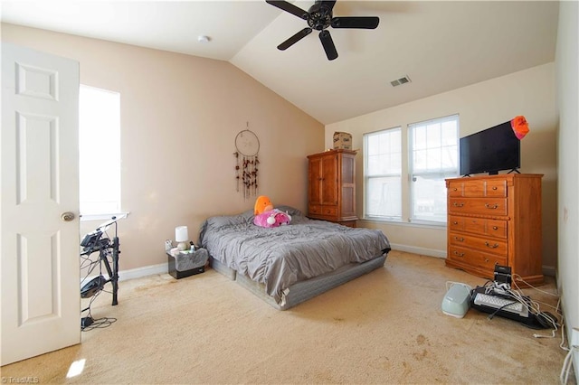 carpeted bedroom with vaulted ceiling and ceiling fan