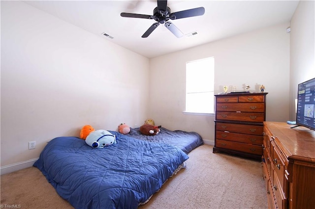 bedroom with ceiling fan and light carpet