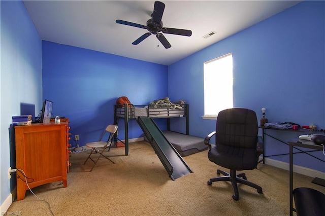 bedroom featuring ceiling fan and light colored carpet