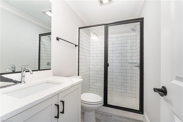 bathroom featuring vanity, toilet, and walk in shower