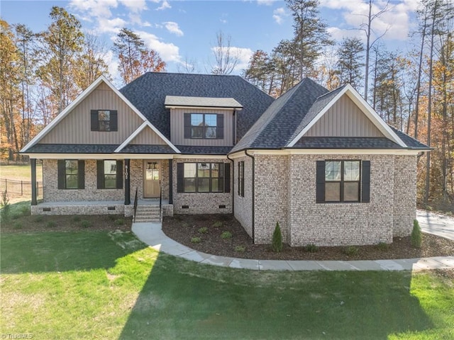 view of front of home featuring a front lawn and covered porch