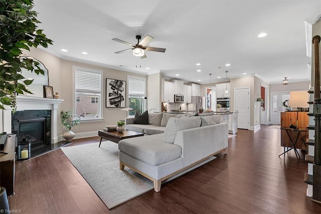 6605 Hedgerow Ct, Summerfield, NC 27358 - living room with a ceiling fan, baseboards, ornamental molding, dark wood-style flooring, and recessed lighting