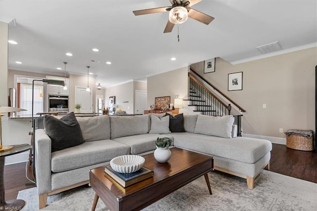 6605 Hedgerow Ct, Summerfield, NC 27358 - living room with crown molding, light wood-style floors, a ceiling fan, stairway, and recessed lighting