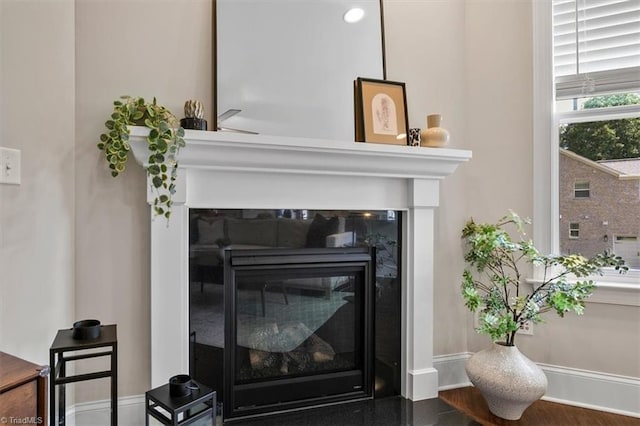 6605 Hedgerow Ct, Summerfield, NC 27358 - detailed view of a glass covered fireplace and baseboards