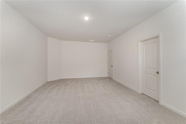 empty room with light colored carpet