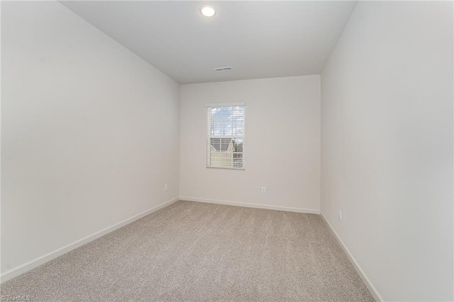 spare room with carpet floors