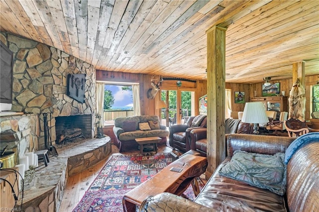 1215 Single Tree Rd, Westfield, NC 27016 - living area featuring wooden ceiling, hardwood / wood-style floors, a fireplace, and wood walls