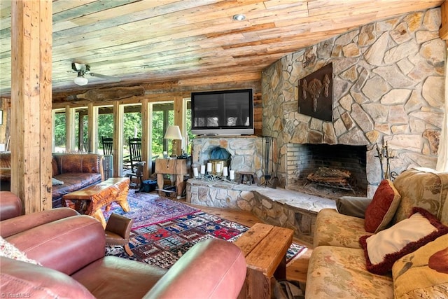 1215 Single Tree Rd, Westfield, NC 27016 - living area featuring wood ceiling, a fireplace, wood finished floors, and a ceiling fan