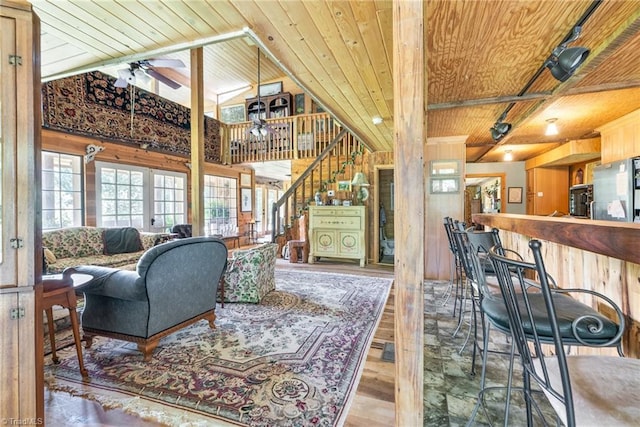 1215 Single Tree Rd, Westfield, NC 27016 - living area with wooden ceiling, wood finished floors, ceiling fan, stairway, and wooden walls