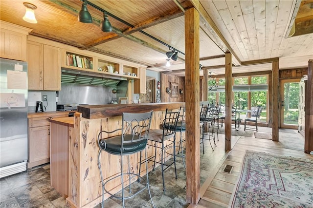 1215 Single Tree Rd, Westfield, NC 27016 - kitchen featuring butcher block countertops, freestanding refrigerator, open shelves, wood ceiling, and a breakfast bar