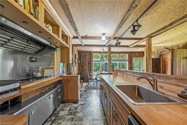 1215 Single Tree Rd, Westfield, NC 27016 - kitchen featuring wood counters, a sink, exhaust hood, stainless steel gas cooktop, and beamed ceiling
