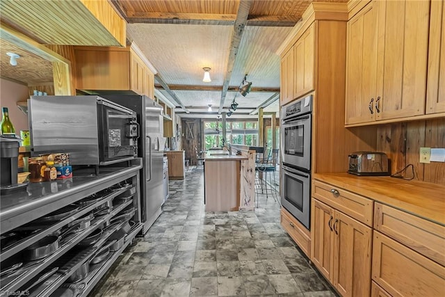 1215 Single Tree Rd, Westfield, NC 27016 - kitchen with double oven and stone finish floors