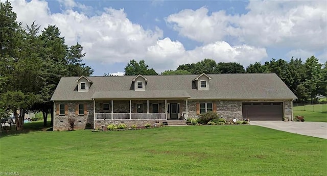 310 Pauline Dr, Lexington, NC 27295 - cape cod house featuring a porch, stone siding, an attached garage, driveway, and a front lawn