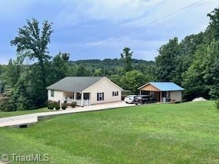 1320 Little Gate Dr, Asheboro, NC 27205 - back of house with a lawn and a view of trees