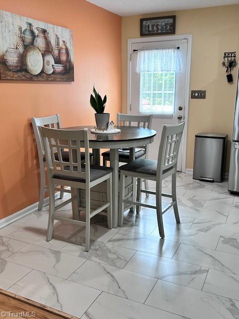 1320 Little Gate Dr, Asheboro, NC 27205 - dining area with light marble finish flooring and baseboards